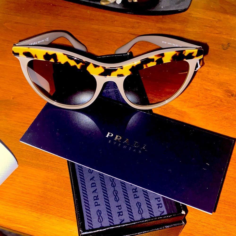 PRADA🚨🚨 Sunglasses. Beautiful cat eye trim.NO SCRATCHES OR DENTS. Worn once.